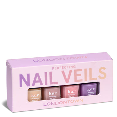 A box of LONDONTOWN Perfecting Nail Veil Mini Set containing three sheer nail polishes in various shades of pink and purple. The sweet pastel pink and lavender design of the box exudes sheer perfection.