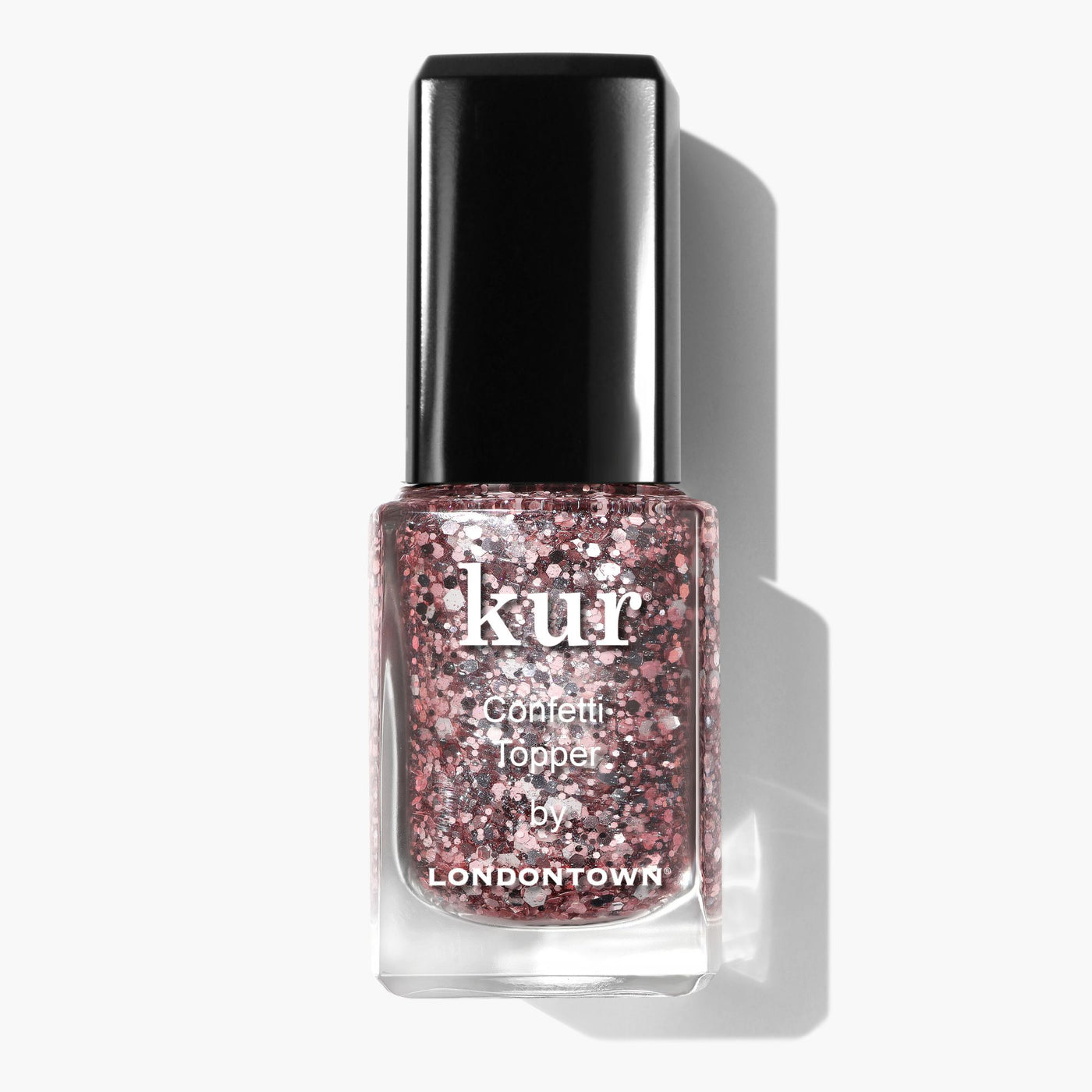 A bottle of LONDONTOWN Snowglobe Confetti Topper nail polish with a black cap, featuring a pink and silver glitter formula for a sparkling finish.