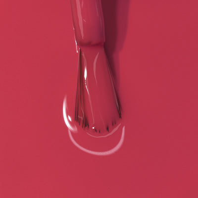 Close-up image of a brush applying LONDONTOWN's Flushed Cheeks nail polish.