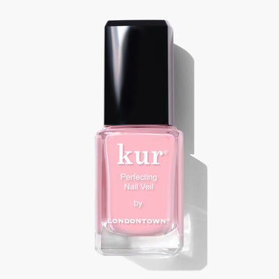 A bottle of LONDONTOWN Perfecting Nail Veil #7 in pink, with a power-packed formula, featuring a black cap and white text on the label, set against a white background.