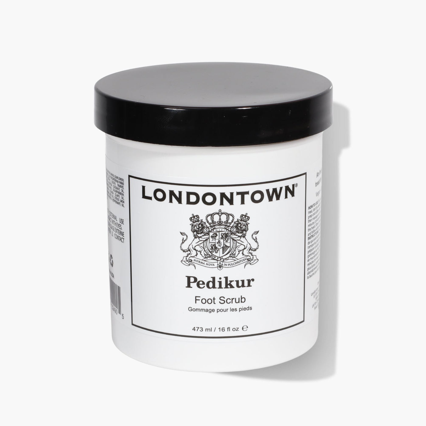 A white and black jar labeled "LONDONTOWN Foot Scrub (Pro Size)," with a capacity of 473 ml (16 oz), promises an invigorating treat for tired feet.