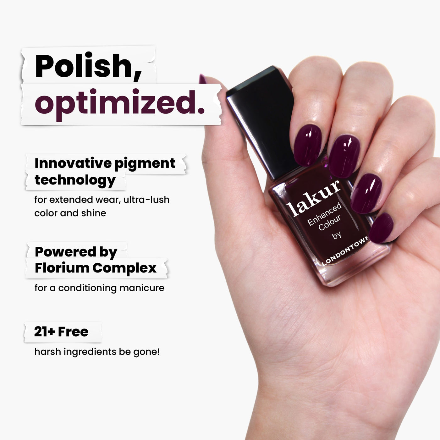 A hand with dark purple nails holds a LONDONTOWN Bell in Time (Professional) polish, featuring innovative pigment technology, a breathable Florium Complex formula, and a 21+ free formulation.