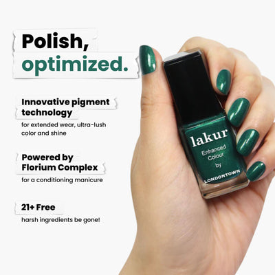 A hand cradles a green nail polish bottle labeled "Mistletoe" by LONDONTOWN, featuring mesmerizing pigment technology powered by Florium Complex. Enhanced with a subtle gold shimmer, it’s free from 21+ harsh ingredients for a truly luxurious experience.