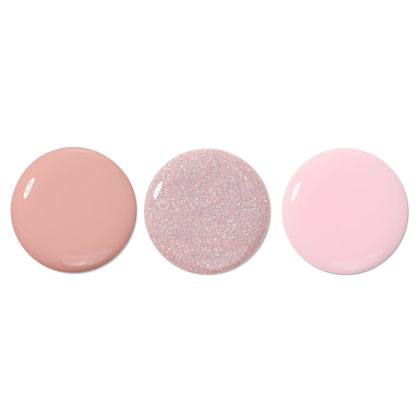 The LONDONTOWN Luscious Blushes lakur Trio features three circular paint swatches: matte beige, glittery blush light pink, and soft pastel pink, arranged in a fresh row on a plain white background.