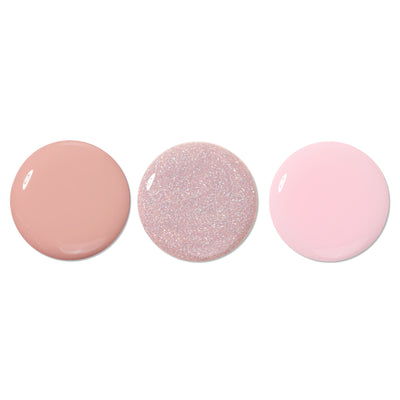 The LONDONTOWN Luscious Blushes lakur Trio features three circular paint swatches: matte beige, glittery blush light pink, and soft pastel pink, arranged in a fresh row on a plain white background.