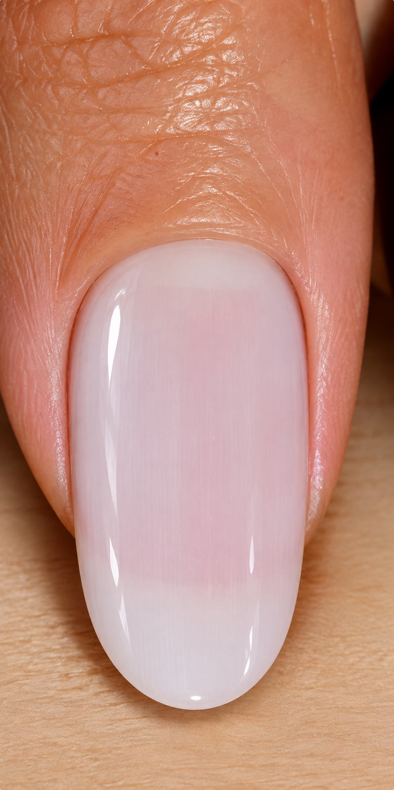 AFTER: A milky pink glow with brighter, more even-looking nails.