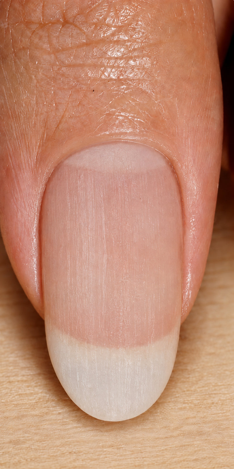 Bare natural nail before Luxe Length Nail Gloss