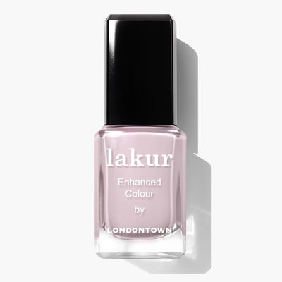 Bottle of LONDONTOWN Afternoon Tea (Professional) nail polish with a warm and cozy light pink crème shade and black cap, labeled 'Enhanced Colour.'