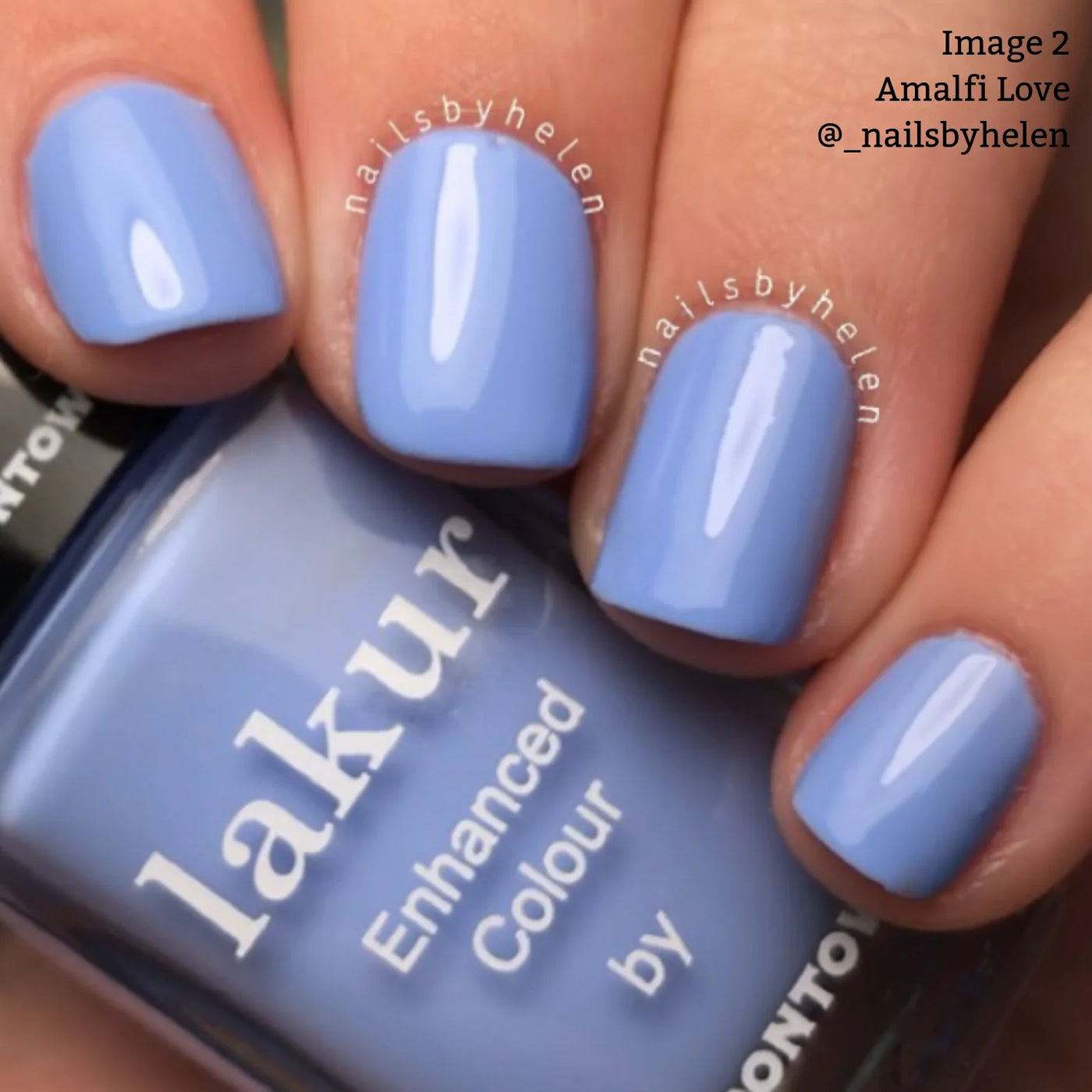 Close-up of a hand with nails painted in a glossy periwinkle blue polish labeled "Amalfi Love (Professional)" by LONDONTOWN, featuring their Florium Complex. Texts "nailsbyhelen" and "Image 2 Amalfi Love @_nailsbyhelen" are visible.