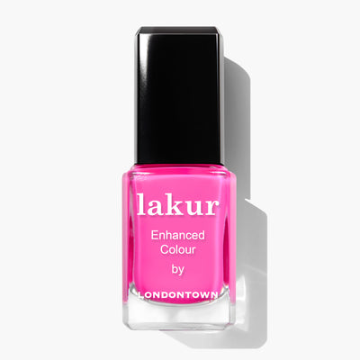 A bottle of Berry Punch nail polish by LONDONTOWN, featuring a vibrant hot pink shade and a sleek black cap. This cruelty-free and vegan formula ensures your nails look fabulous while staying kind to animals.