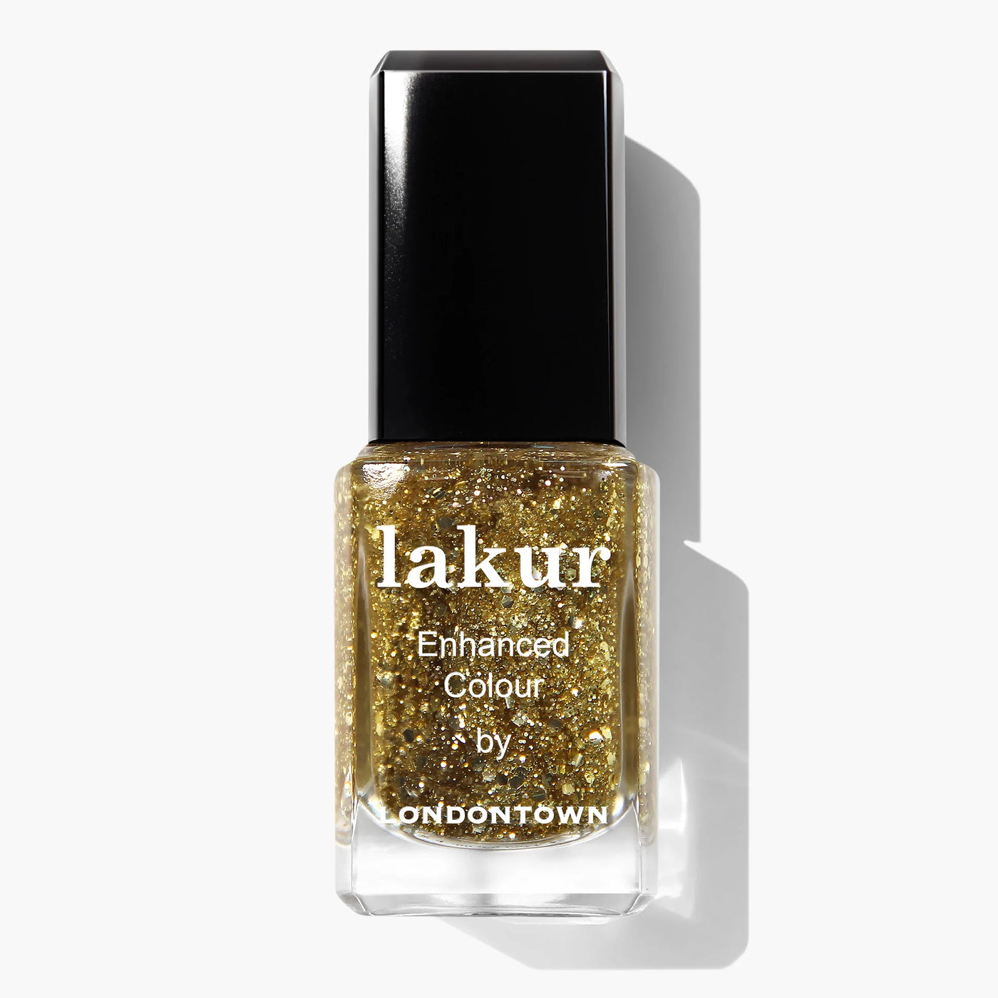 A bottle of Britannia (Professional) by LONDONTOWN nail polish with gold glitter and a transparent base, featuring a rectangular black cap and a clear square bottle. This cruelty-free polish adds a touch of elegance to your nails.