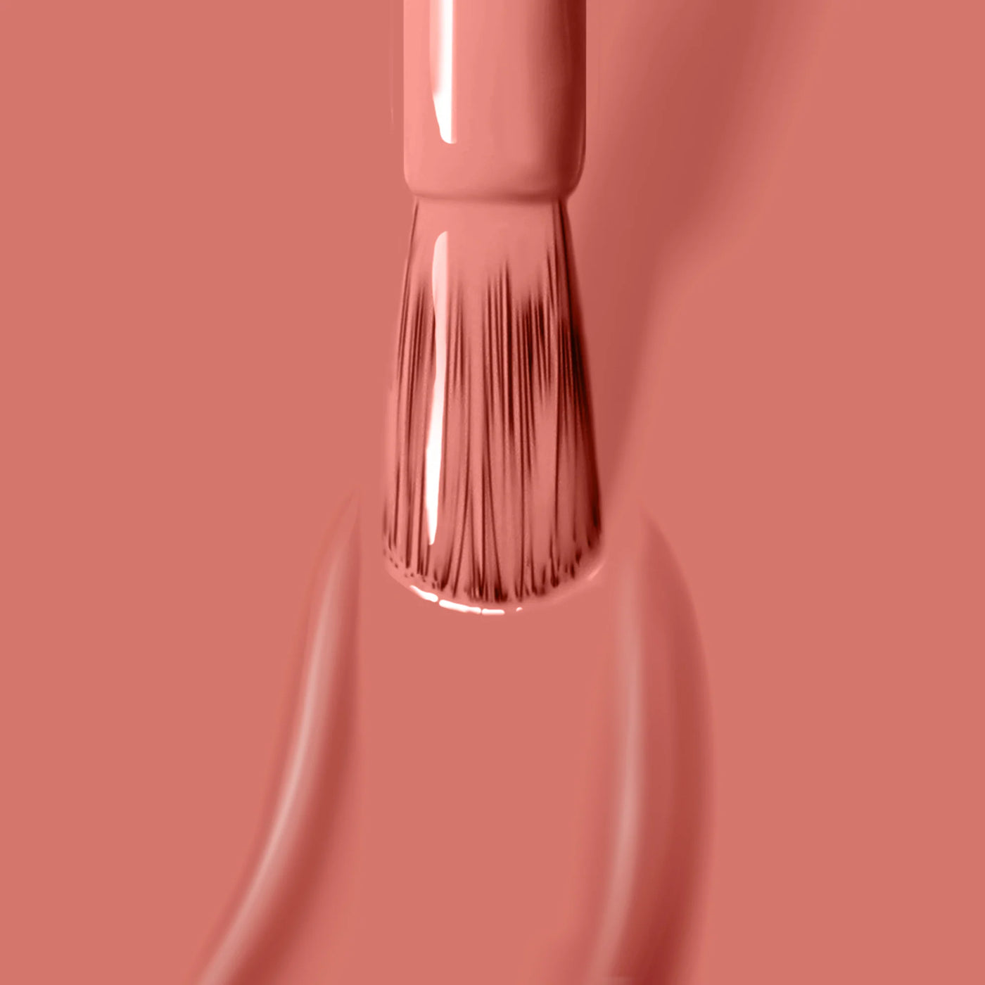 A close-up of the LONDONTOWN Cactus Coral (Professional) nail polish brush applying a coat of peach-colored nail polish that is cruelty-free.