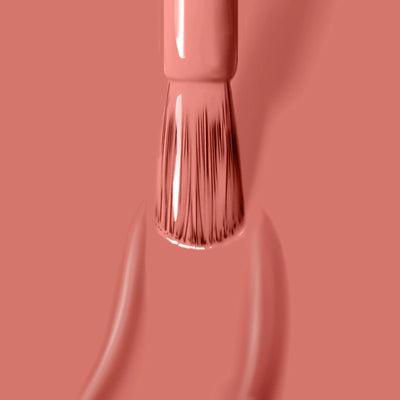 A close-up of the LONDONTOWN Cactus Coral (Professional) nail polish brush applying a coat of peach-colored nail polish that is cruelty-free.