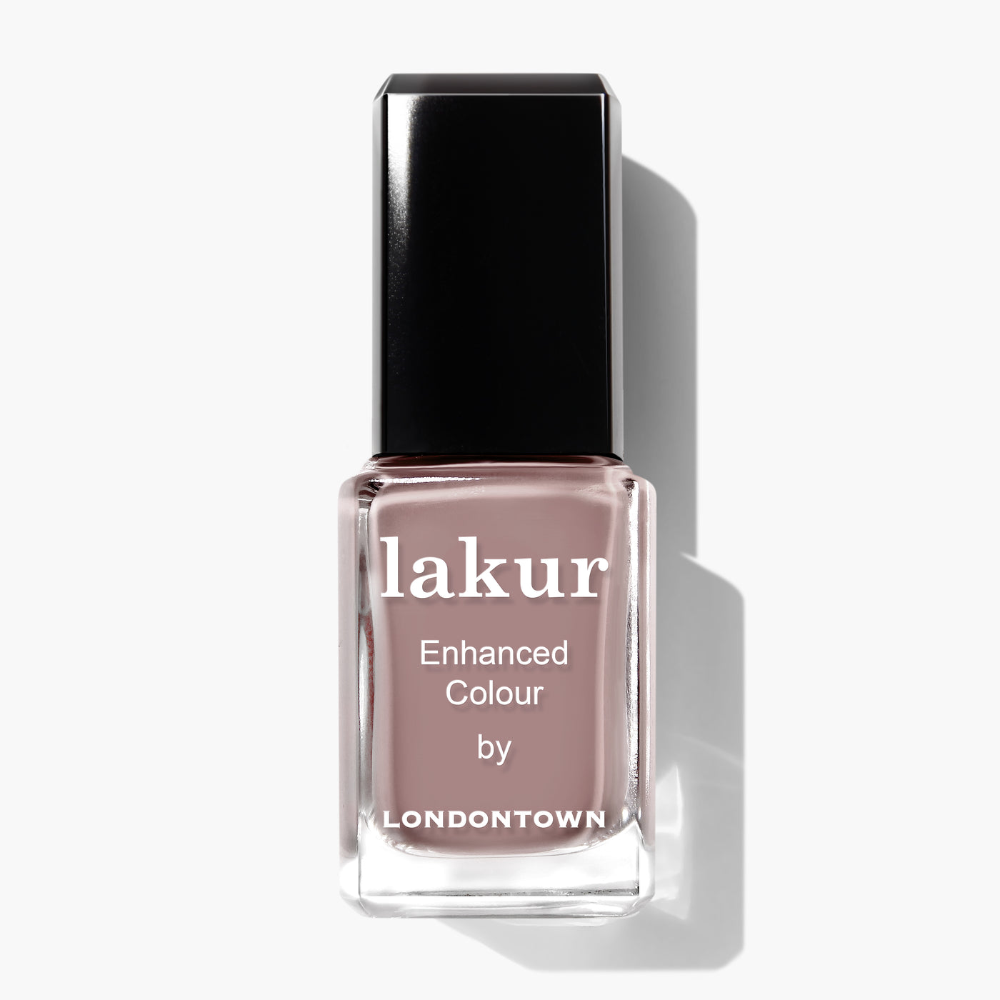 A bottle of Chai enhanced colour nail polish by LONDONTOWN, featuring a spiced taupe shade and a black rectangular cap, perfect for a sophisticated crème finish.