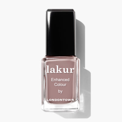 A bottle of Chai enhanced colour nail polish by LONDONTOWN, featuring a spiced taupe shade and a black rectangular cap, perfect for a sophisticated crème finish.