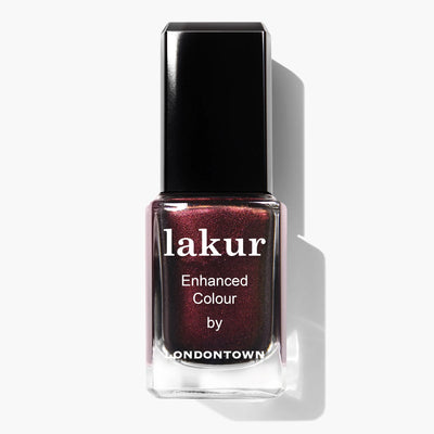 A bottle of LONDONTOWN's Cockney Glam (Professional) nail polish, showcasing a dark maroon hue with a black cap and brand text on the front. This vegan, cruelty-free nail polish is formaldehyde free and offers a rich, red-toned metallic crème finish.