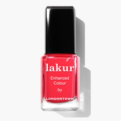 A bottle of Down to Dilly nail polish by LONDONTOWN in a bright red shade, set against a white background. This vegan, cruelty-free nail polish exemplifies LONDONTOWN's commitment to quality and ethical beauty.