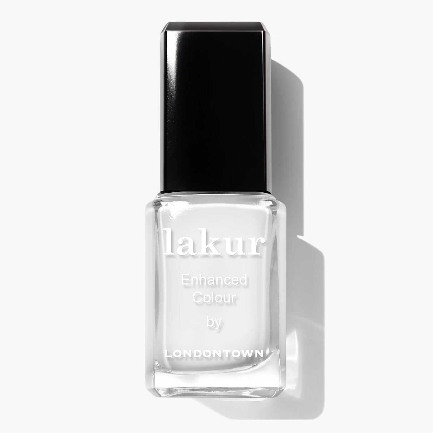 A bottle of LONDONTOWN Lakur Enhanced Colour nail polish in the shade "Duchess (Professional)," featuring a pure crème white color with a black cap, ideal for a French manicure, set against a clean white background. This vegan and cruelty-free formula enhances your nail care routine with elegance.