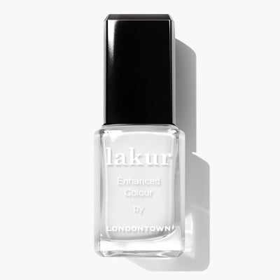 A bottle of LONDONTOWN Lakur Enhanced Colour nail polish in the shade "Duchess (Professional)," featuring a pure crème white color with a black cap, ideal for a French manicure, set against a clean white background. This vegan and cruelty-free formula enhances your nail care routine with elegance.