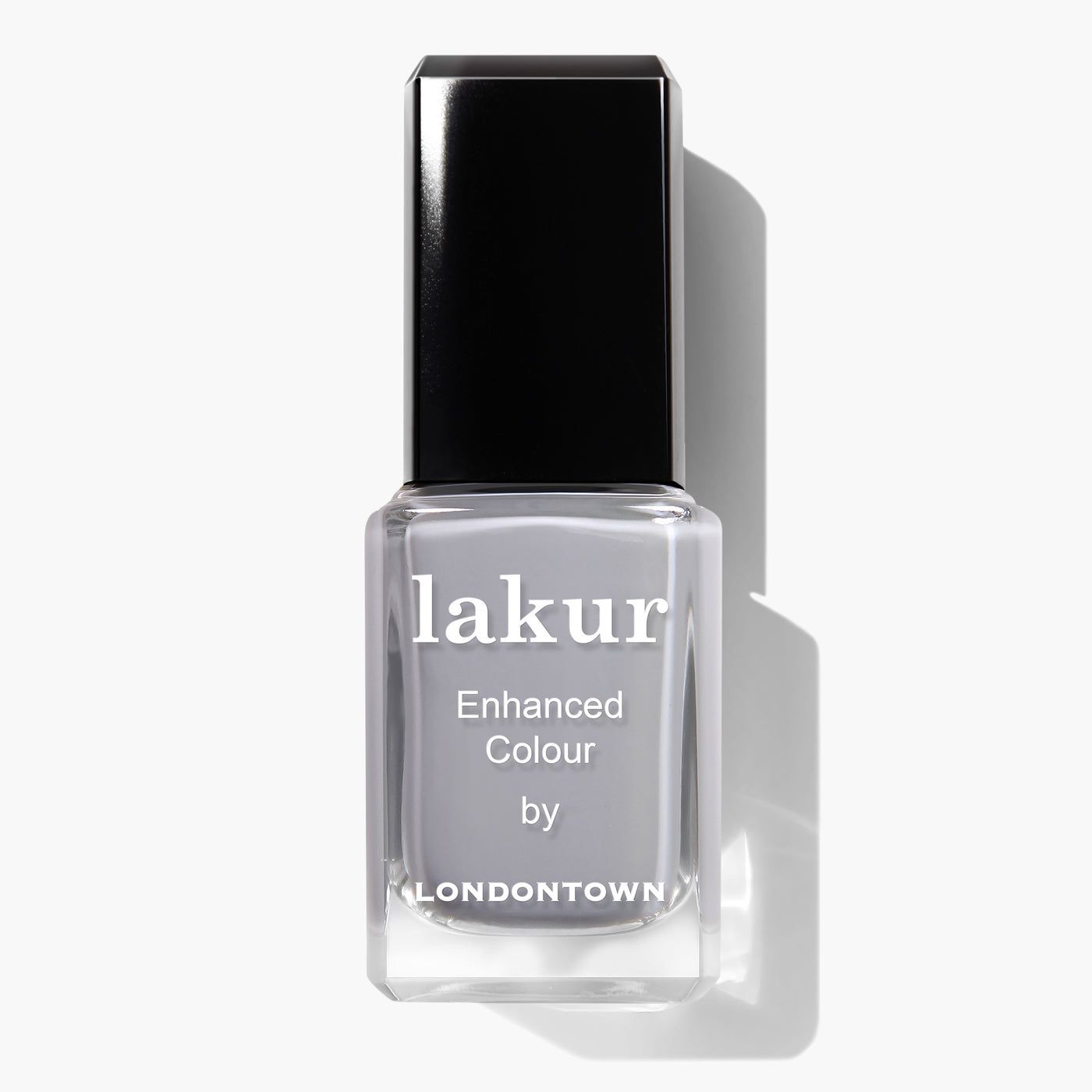 A bottle of LONDONTOWN's Earl Grey Lakur Enhanced Colour nail polish, featuring a black cap and a clear body that showcases grey-colored, cruelty-free vegan polish.