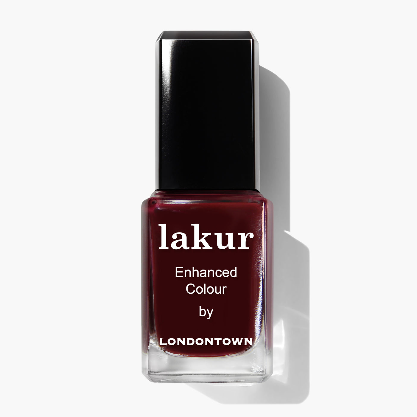 A bottle of Elderberry nail polish from LONDONTOWN in a dark red shade, teeming with depths of blackened purple. The bottle has a black cap and labels indicating "Enhanced Colour by LONDONTOWN," adding an air of mystery.