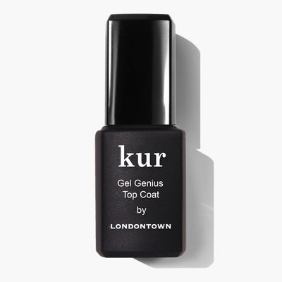 A black nail polish bottle labeled "Gel Genius Top Coat (Professional) by LONDONTOWN," promising gel-like durability and an ultra-glossy finish, rests against a pristine white background.