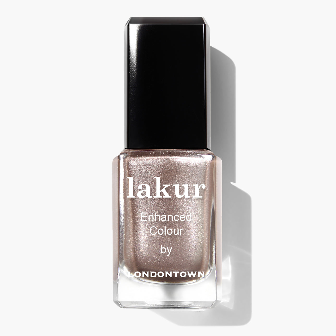 A bottle of nail polish labeled "Gilded" by LONDONTOWN, featuring a cool champagne shade and a black cap. This vegan cruelty-free option is also PETA certified, ensuring both style and ethical standards are met.