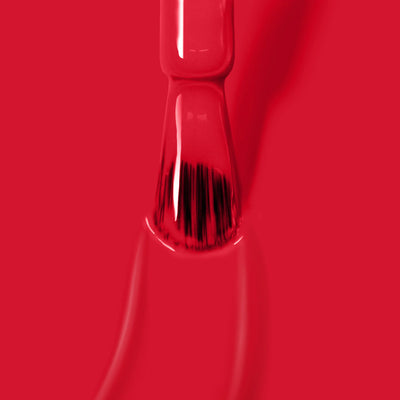 Close-up of the brush applying LONDONTOWN's glossy, cruelty-free, vegan "Guilty Pleasure (Professional)" red nail polish.