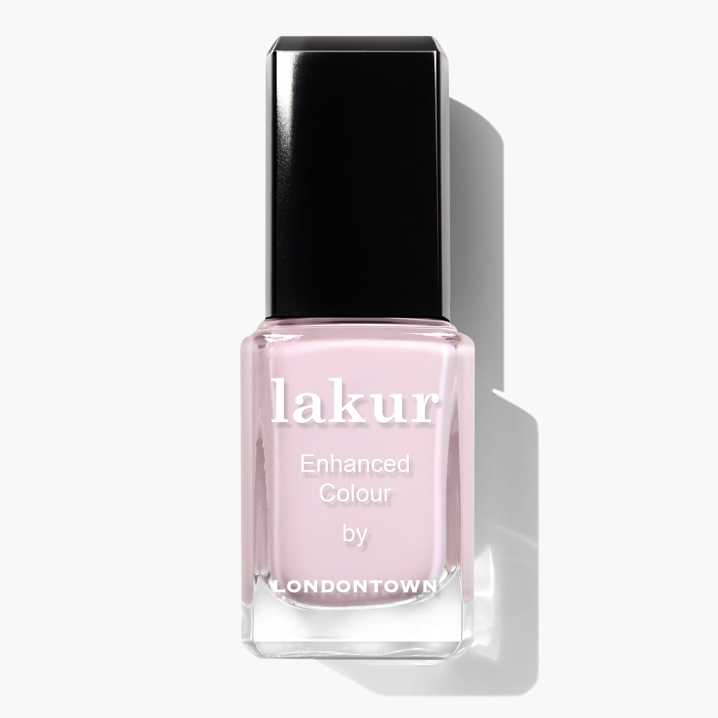 A bottle of Jane Austen by LONDONTOWN, featuring a light pink shade and a black cap. This lavender crème nail polish is vegan, cruelty-free, and one of their "16+ Free" products.