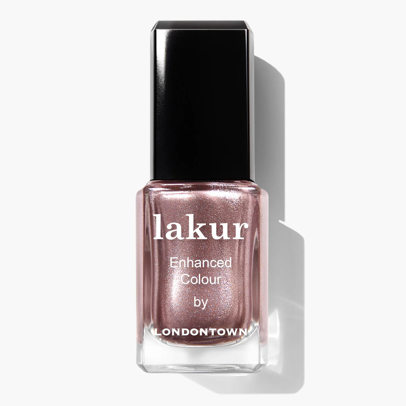 A bottle of LONDONTOWN's Kissed by Rose Gold (Professional) nail polish in a metallic rose gold shade with a black cap. This vegan, cruelty-free, PETA certified beauty is the perfect choice for a chic and conscientious manicure.