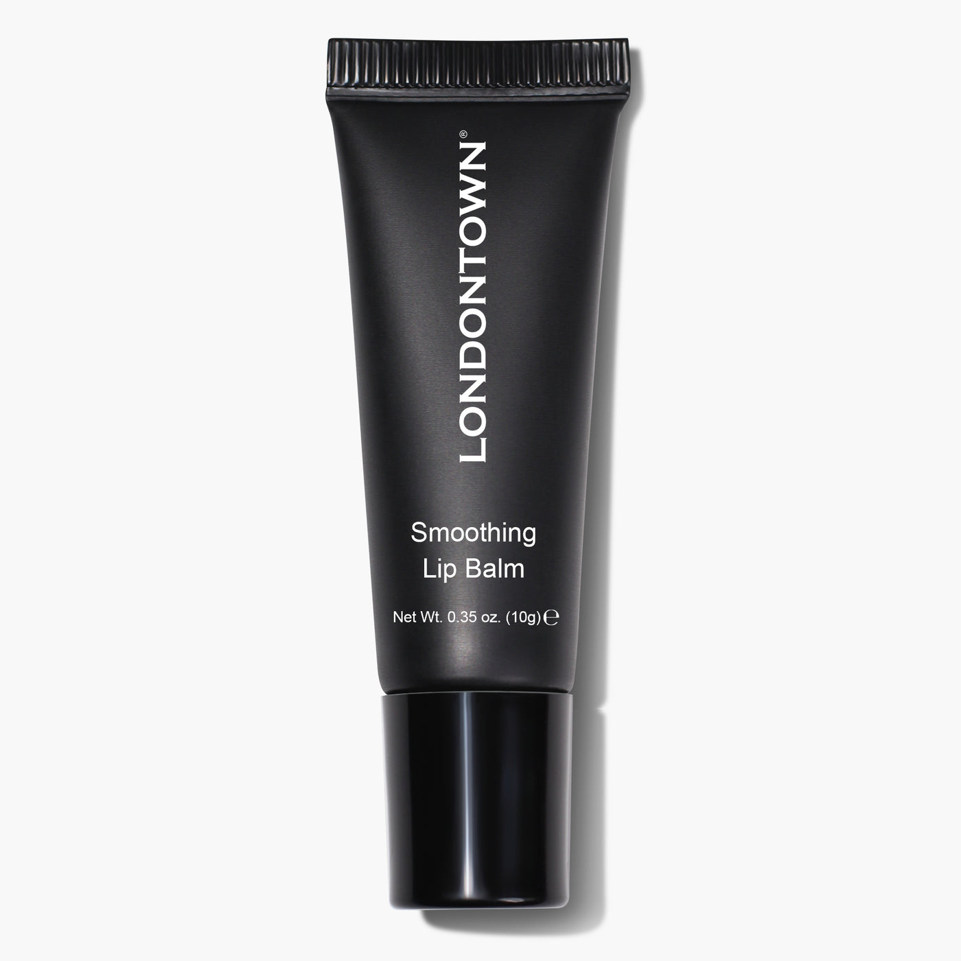 A black tube of Smoothing Lip Balm from LONDONTOWN, featuring white text indicating its name and net weight of 10 grams (0.35 oz), provides an ultra-rich, conditioning lip treatment.