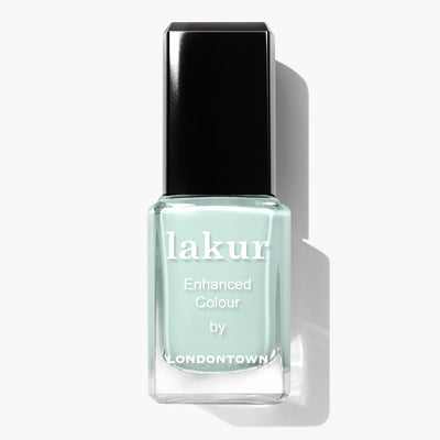 A bottle of LONDONTOWN Mint No Chip vegan nail polish labeled "Enhanced Colour" in a mint creme shade with a black cap.
