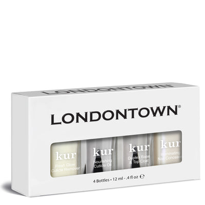 A box of LONDONTOWN's Nail Care + Concealer System, which includes 12 ml each of Fresh Glow Cuticle Remover, Nourishing Cuticle Oil, Duplex Base & Top Coat, and Illuminating Nail Concealer.