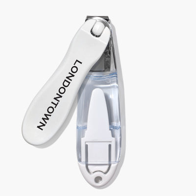 The Flex Cut Nail Clippers (Professional) by LONDONTOWN feature an ultra-precise stainless steel cutting edge, a clear ergonomic handle, and "LONDONTOWN" printed on the lever.