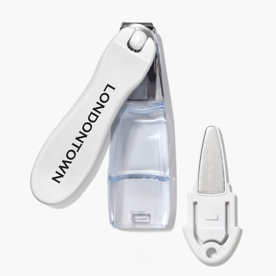 The Flex Cut Nail Clippers by LONDONTOWN are white and feature the brand name printed on the side. They boast ultra-precise clippers and an all-in-one design that includes a separate metal nail file attachment.