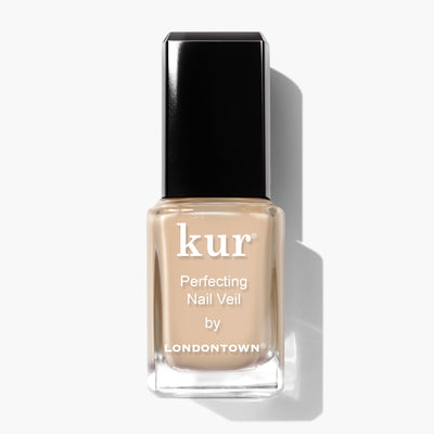 A bottle of LONDONTOWN's Perfecting Nail Veil #2 (Professional) with a black cap, featuring a power-packed beige nail polish, set against a white background.