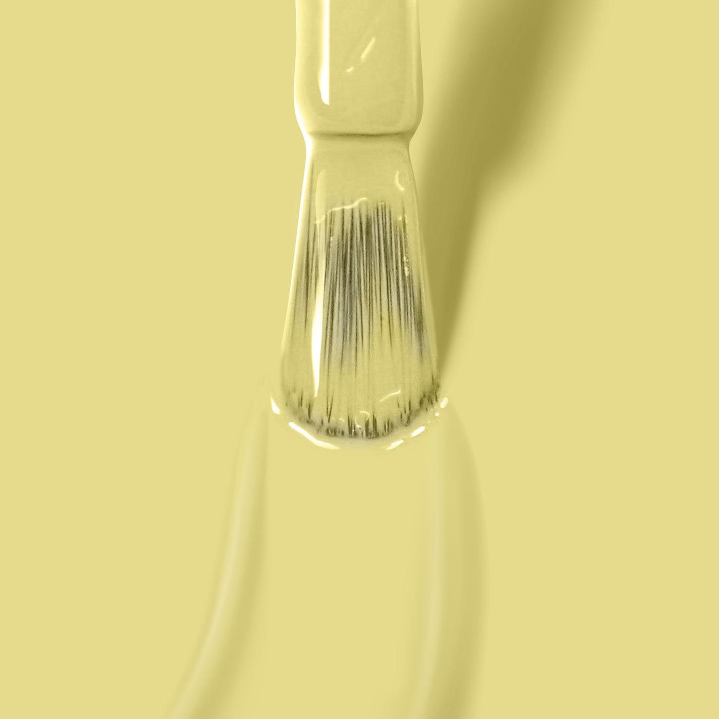 A paintbrush with Notting the Fancy by LONDONTOWN is positioned against a light yellow background.