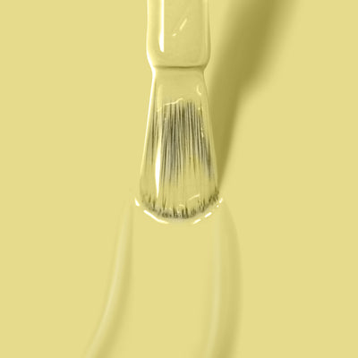 A paintbrush with Notting the Fancy by LONDONTOWN is positioned against a light yellow background.