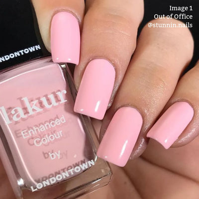 Close-up of a hand with pink-painted nails holding a bottle of pastel pink nail polish labeled "lakur Enhanced Colour by LONDONTOWN." Text reads "16+ Free, Vegan Cruelty-Free." Image 1 showcases the shade Out of Office @stunnin.nails.