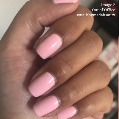 A hand showing a close-up of neatly manicured nails painted in LONDONTOWN's vegan, cruelty-free pastel pink nail polish, Out of Office (Professional). Text on the image reads: "Image 2 @nailsbymadab3auty".