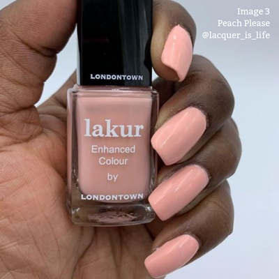 A hand with peach-colored nail polish holds a bottle of LONDONTOWN's Lakur Enhanced Colour in the shade "Peach Please," celebrated for its vegan and cruelty-free formula. Text in the top right says "Image 3 Peach Please @lacquer_is_life.