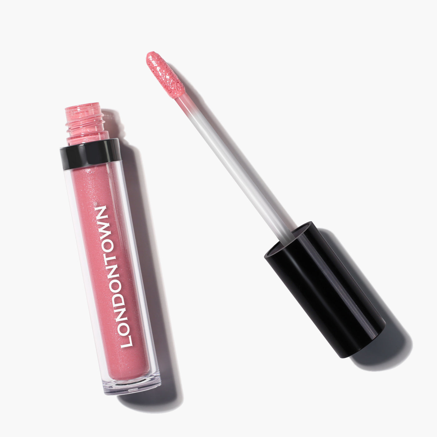 A tube of Plush Shine Lip Gloss in the shade "Pixie" labeled "LONDONTOWN," with its applicator wand resting beside it.
