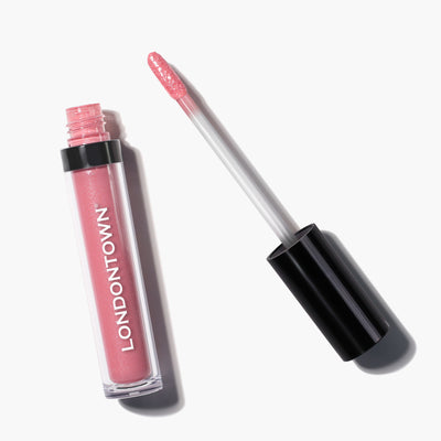 A tube of Plush Shine Lip Gloss in the shade "Pixie" labeled "LONDONTOWN," with its applicator wand resting beside it.
