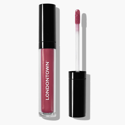 A tube of LONDONTOWN's Plush Shine Lip Gloss in the Posh shade, with a detached applicator placed to the right.
