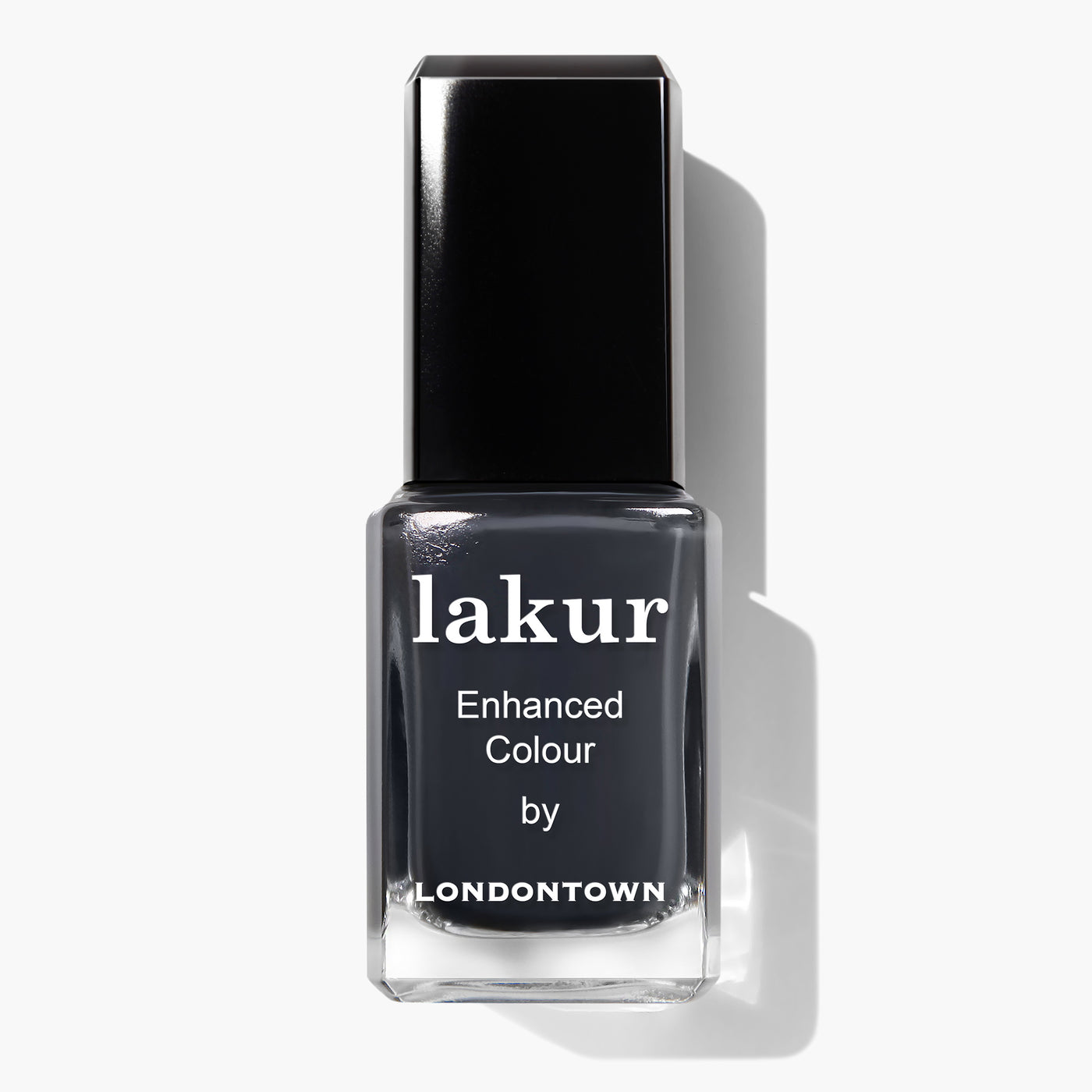 A bottle of Lakur Enhanced Colour nail polish in the shade "Put the Kettle On" by LONDONTOWN, featuring a dark gray hue and a black cap. This vegan, cruelty-free nail polish is also 16+ Free, making it an excellent choice for conscious consumers.