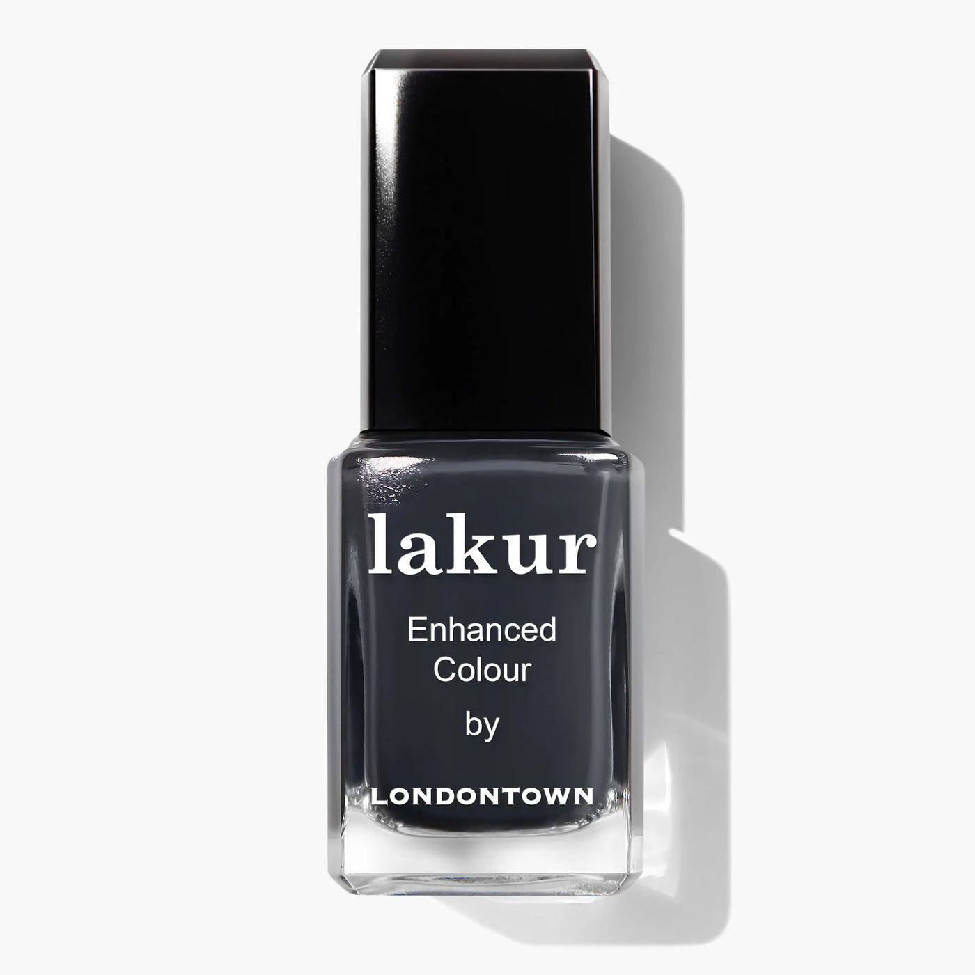 A bottle of LONDONTOWN's Lakur vegan nail polish called "Put the Kettle On (Professional)" in a dark gray shade with a black cap and the text "Enhanced Colour by Londontown" on the label.