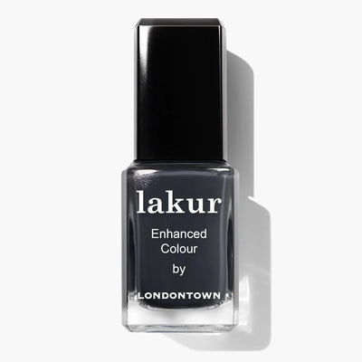 A bottle of LONDONTOWN's Lakur vegan nail polish called "Put the Kettle On (Professional)" in a dark gray shade with a black cap and the text "Enhanced Colour by Londontown" on the label.