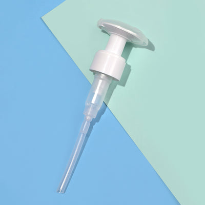 A LONDONTOWN Lacquer Remover Pump in white plastic is seen from above, set against a blue and green background.