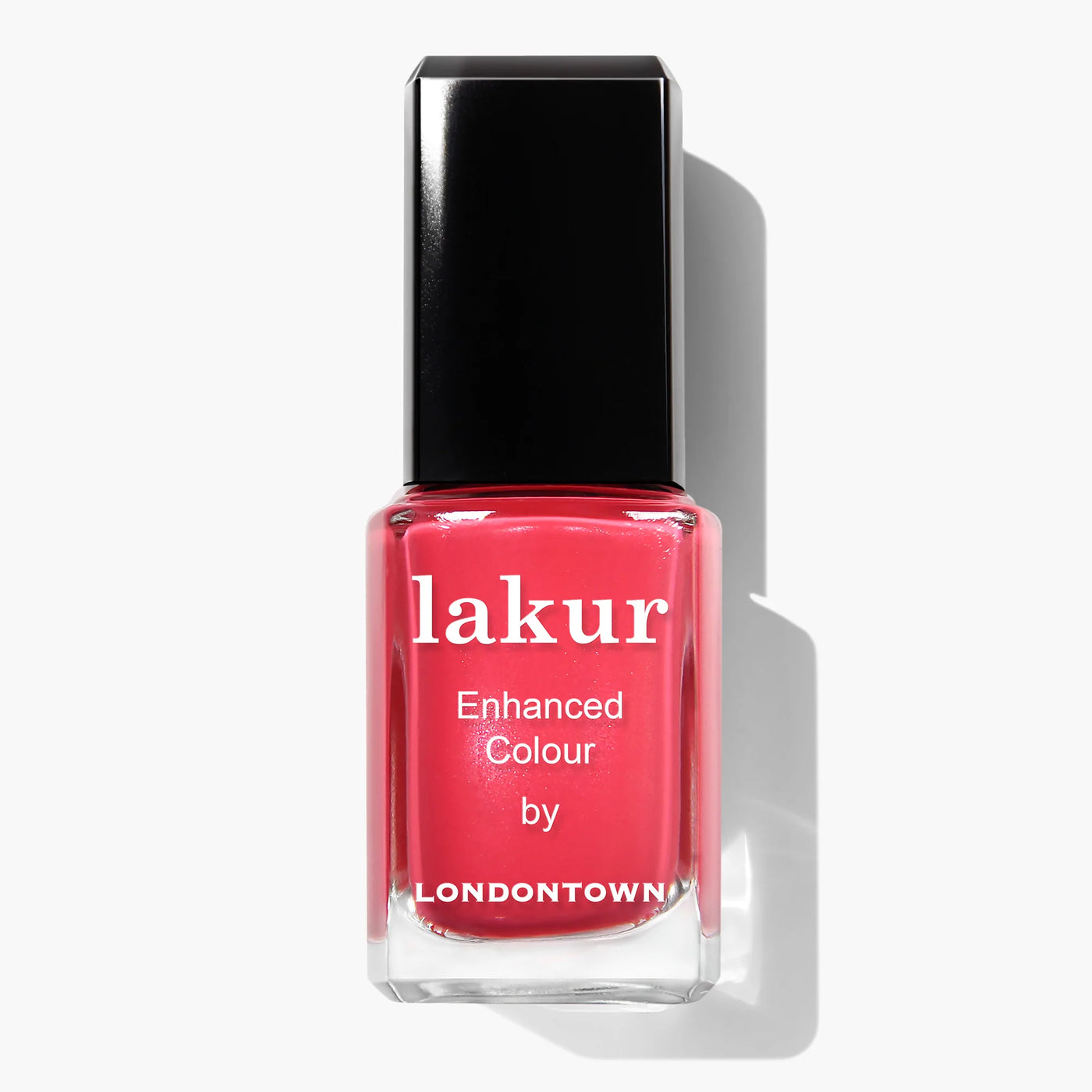 A bottle of Weekend Cheers (Professional) nail polish by LONDONTOWN. This vegan, cruelty-free polish is a vibrant coral pink shade with a black cap and white text on the bottle, showcasing the quality that makes LONDONTOWN polishes a favorite among enthusiasts.