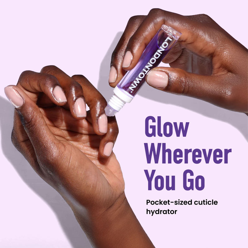 Hands applying cuticle hydrator; text reads "Glow Wherever You Go" and "Pocket-sized Violet Vibes Trio by LONDONTOWN for sheer purple perfection in just 5 minutes.